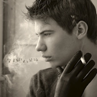 Teenage boy continues to smoke